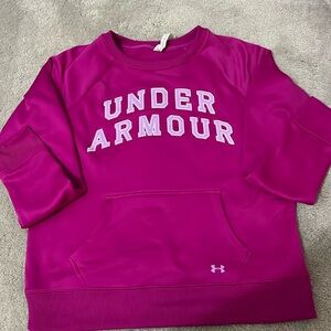 Women’s under Armour sweatshirt with front pocket. Fuchsia color.